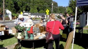 People shopping at a yard sale